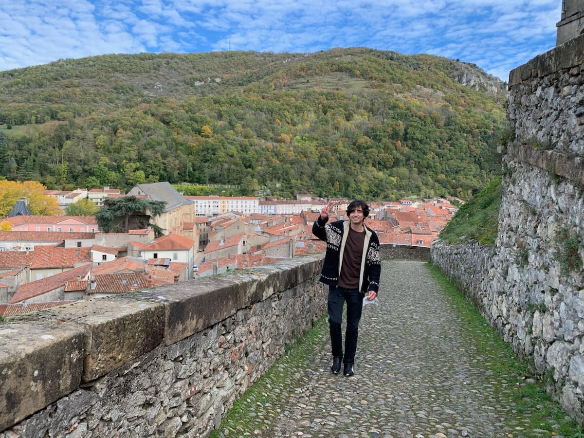 Alejandro at a hilltop city